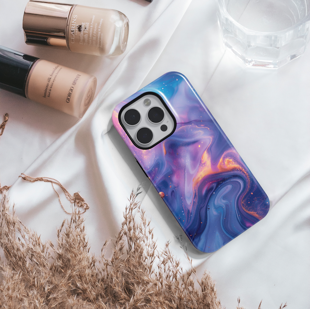 Abstract galaxy swirl iPhone 16 MagSafe case in dreamy purple, blue, and gold tones – aesthetic, protective, and perfect for a cosmic look.