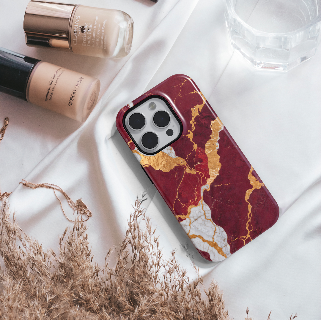Burgundy marble phone case with gold and white crackle design – compatible with iPhone 16, 16 Pro Max, Galaxy S24 Ultra, MagSafe-ready tough case.