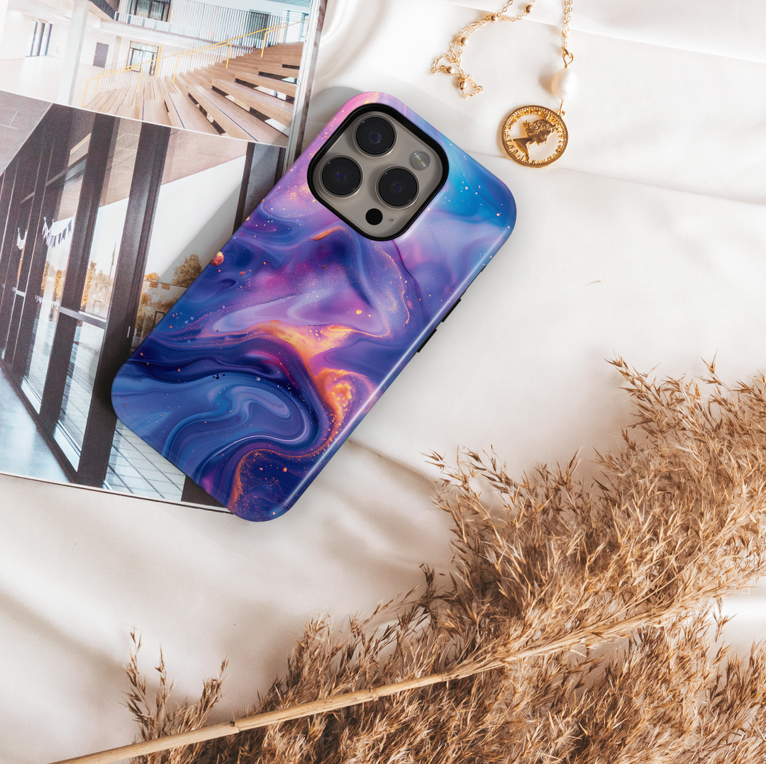 Abstract galaxy swirl iPhone 16 MagSafe case in dreamy purple, blue, and gold tones – aesthetic, protective, and perfect for a cosmic look.