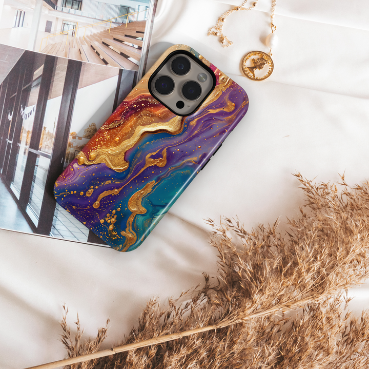 Tough iPhone 16 MagSafe case featuring vibrant purple, teal, and gold swirl design with a glossy finish.