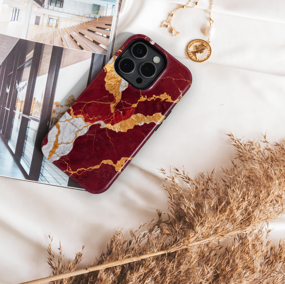 Burgundy marble phone case with gold and white crackle design – compatible with iPhone 16, 16 Pro Max, Galaxy S24 Ultra, MagSafe-ready tough case.