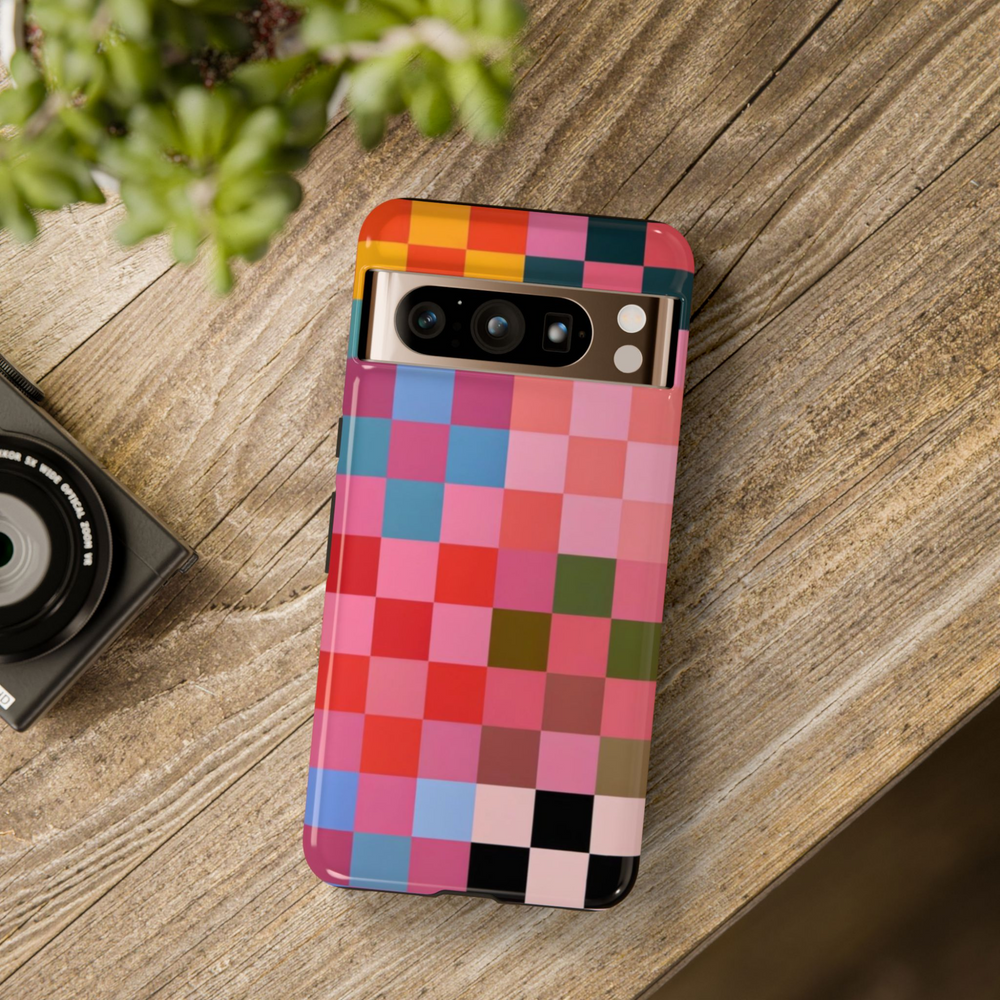Colorful checkerboard phone case with a bold pixel-style grid featuring red, blue, pink, orange, and green blocks – fun and artistic cover for Google Pixel