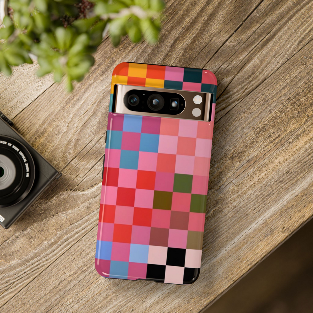 Colorful checkerboard phone case with a bold pixel-style grid featuring red, blue, pink, orange, and green blocks – fun and artistic cover for Google Pixel