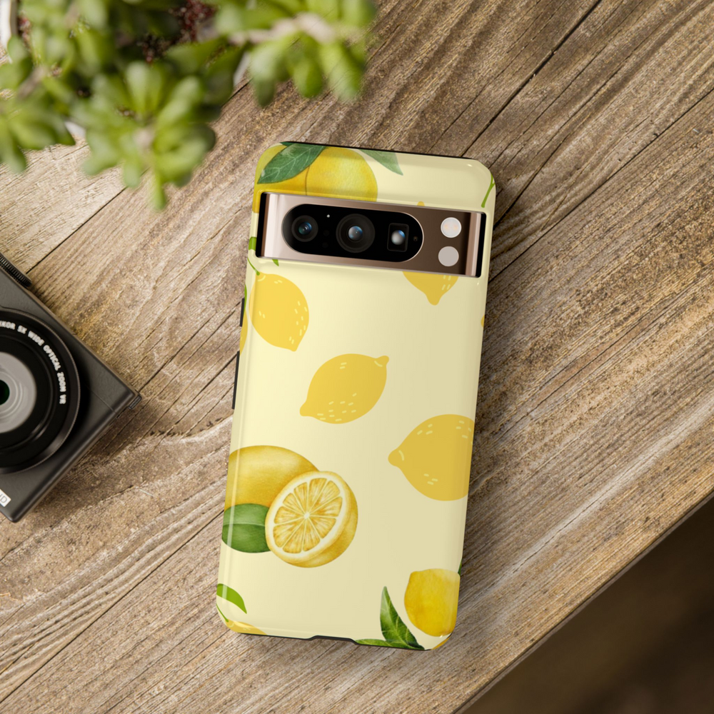 Aesthetic lemon phone case with whole and sliced yellow lemons on a pastel cream background – fresh citrus design for Google Pixel