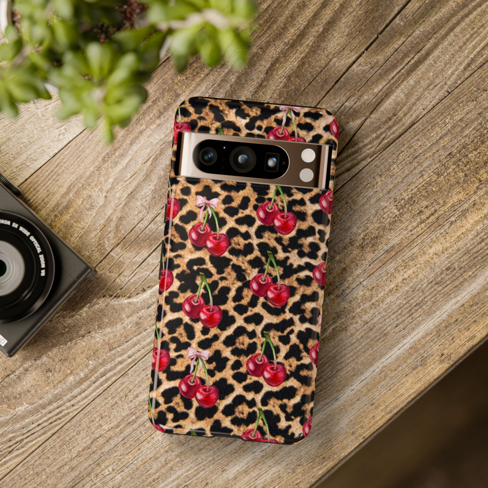 Google Pixel case with leopard print background and red cherry illustrations