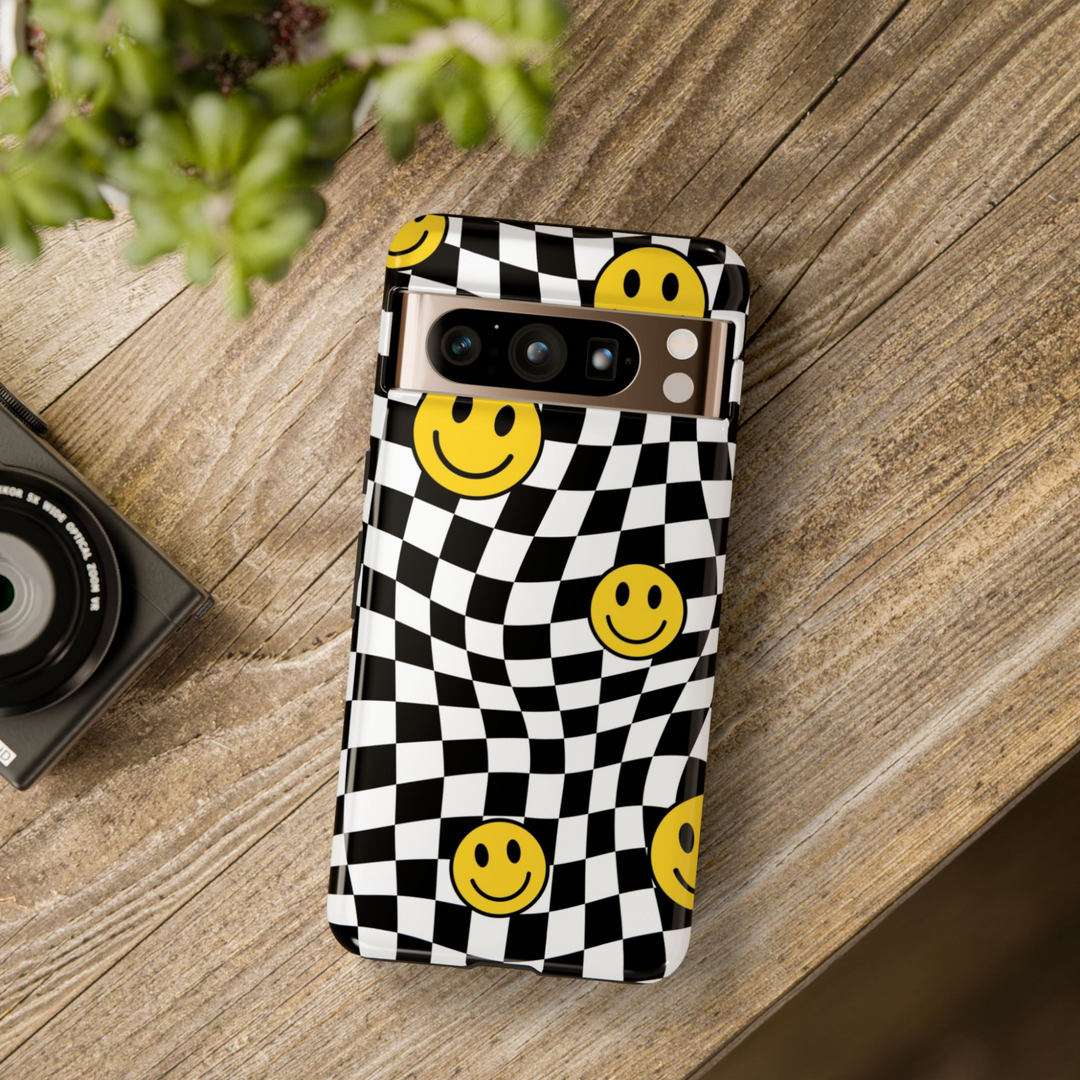 Distorted checkerboard Pixel case with yellow smiley faces – bold trippy aesthetic tough cover for Google Pixel models