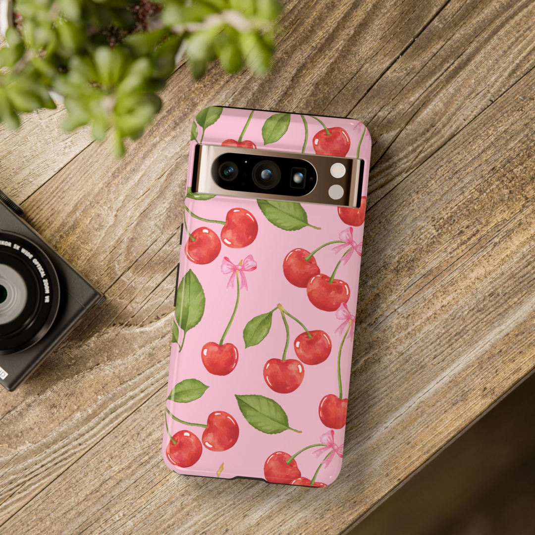 Pink Google Pixel case with red cherry and green leaf watercolor pattern and delicate pink bows – coquette aesthetic tough cover for Pixel 8, Pixel 8 Pro, and Pixel 9 Pro XL