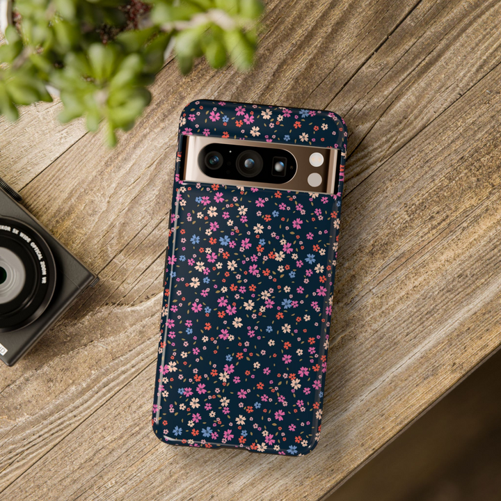 Dark floral tough Google Pixel case featuring tiny pink, red, blue, and cream flowers on a black background – compatible with Pixel 8, Pixel 8 Pro, Pixel 9 Pro XL