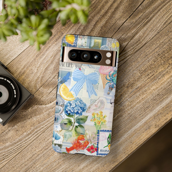 Google Pixel phone case with aesthetic collage of coastal elements including blue bow, lobster, hydrangea, lemon, ice cream, and seashells