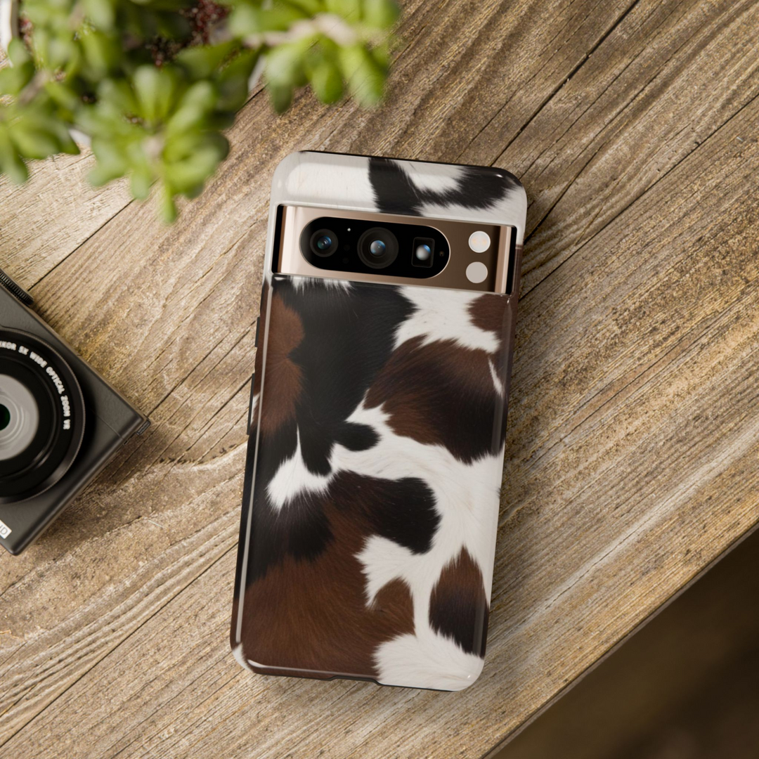 Cowhide Google Pixel tough case with brown, black, and white pattern – protective aesthetic cover for Pixel 8, Pixel 8 Pro, Pixel 9 Pro XL