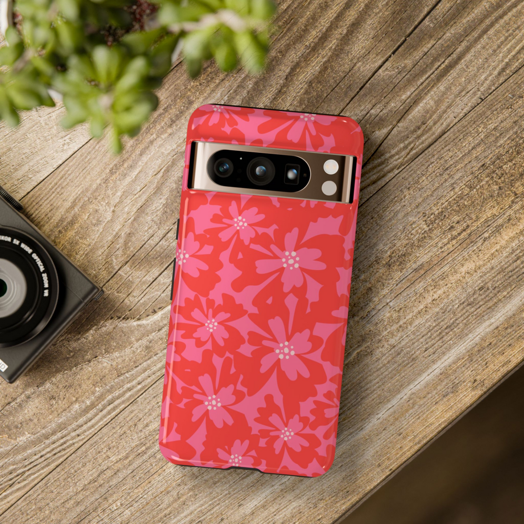 Google Pixel phone case with bold red and pink layered floral pattern in a retro girly aesthetic