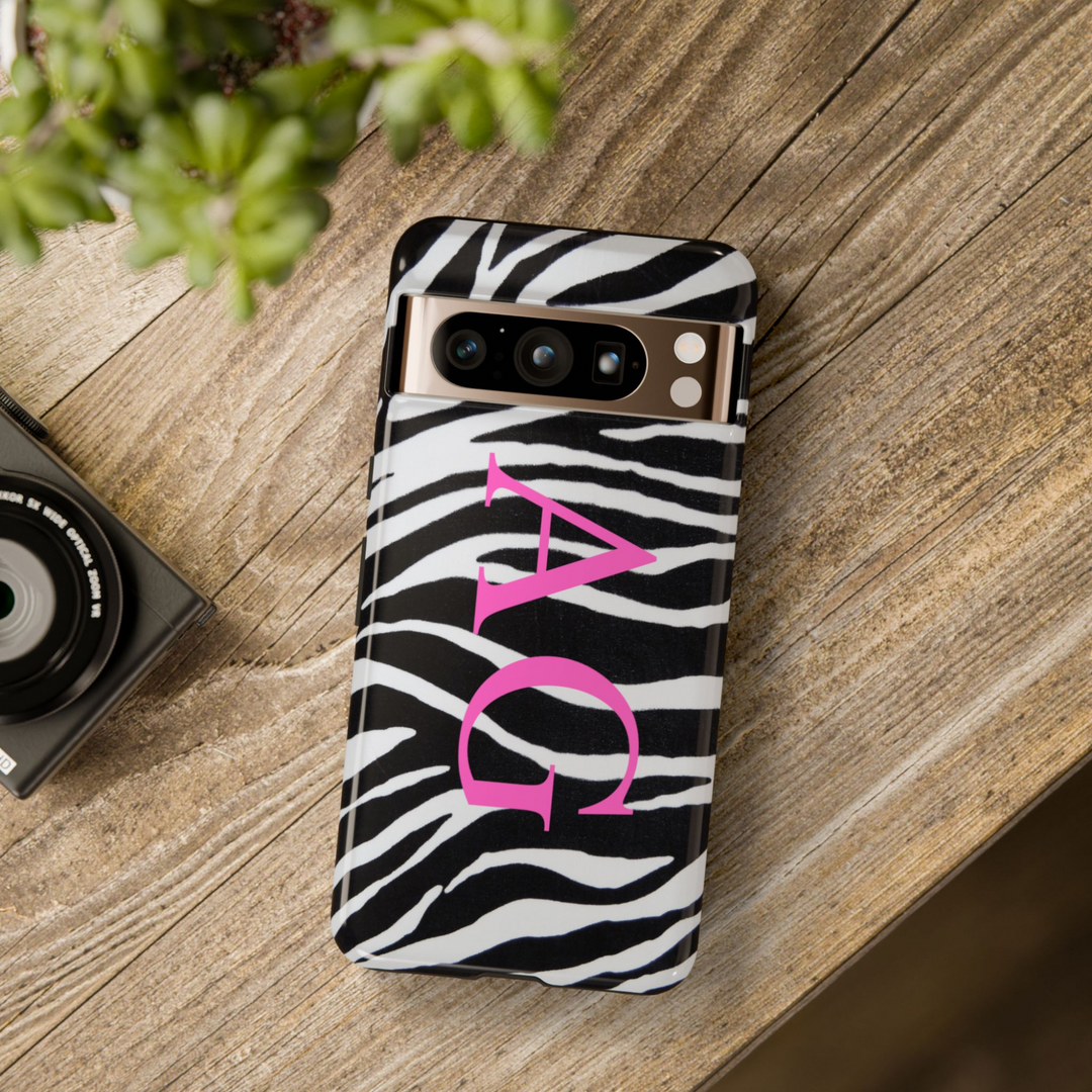 Google Pixel case with black and white zebra pattern and bold pink monogram initials "AG" in vertical layout