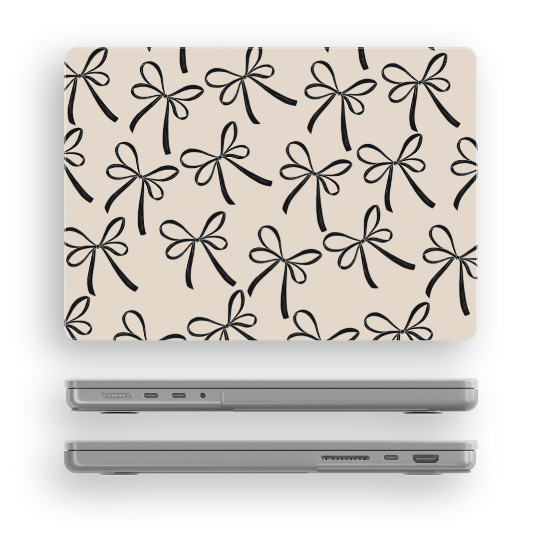 Beige MacBook case with black ribbon bow pattern, elegant minimal aesthetic laptop cover for MacBook Pro and MacBook Air models