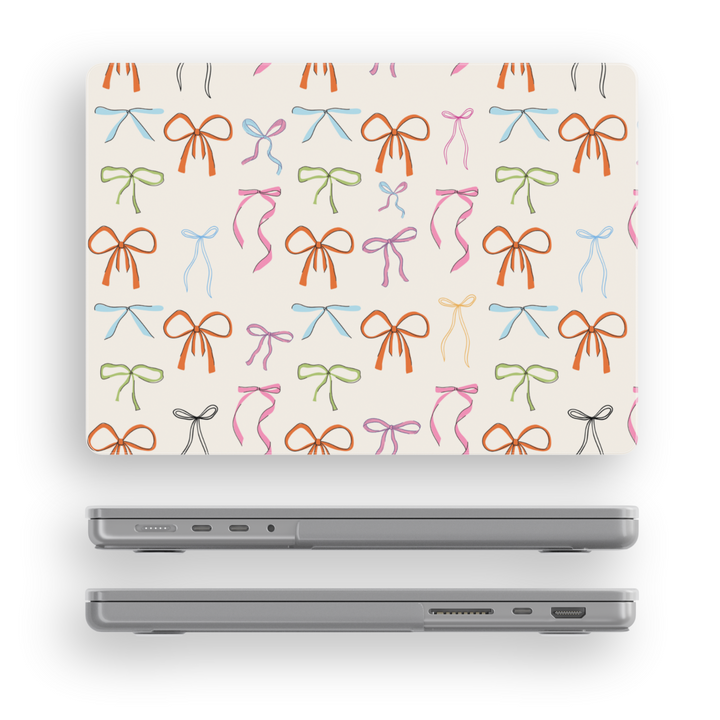 Playful MacBook case with colorful hand-drawn ribbon bows on a cream background, perfect for students, creatives, and aesthetic laptop setups.