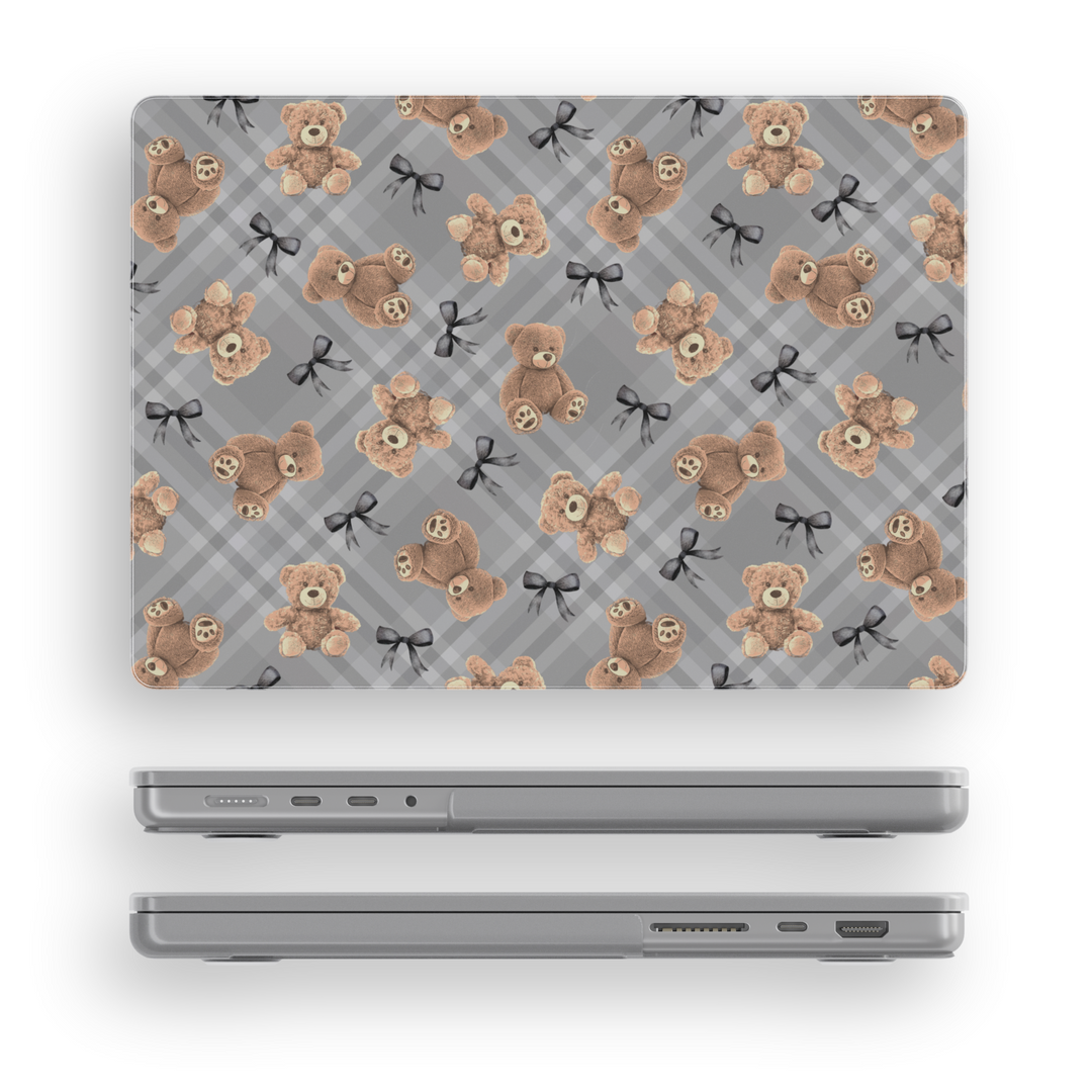 Chic MacBook case featuring soft teddy bears and black bows over a grey plaid background, perfect for students, professionals, and creatives.