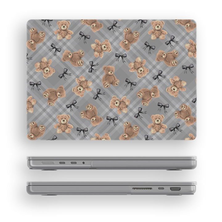 Chic MacBook case featuring soft teddy bears and black bows over a grey plaid background, perfect for students, professionals, and creatives.
