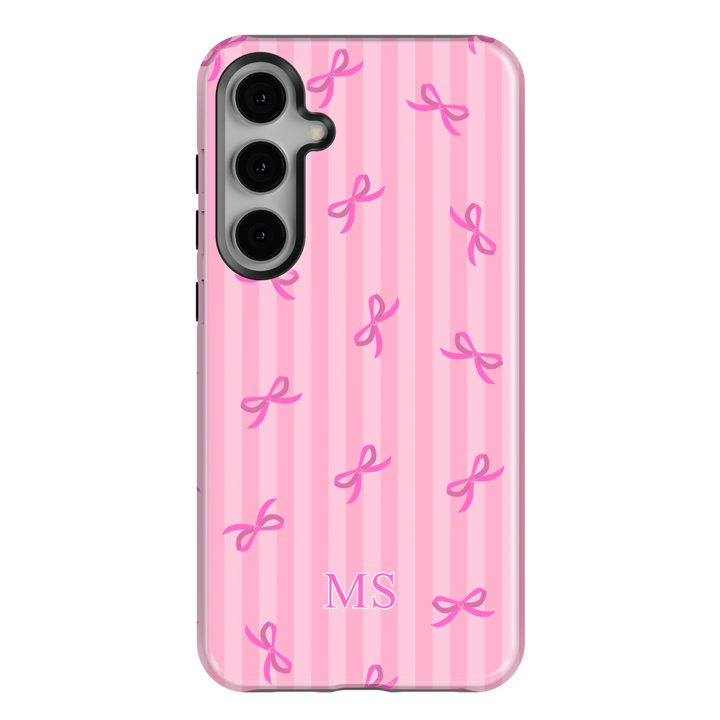 Samsung Galaxy phone case with pink vertical stripes and pink bows, customized with white monogram initials – girly aesthetic tough cover