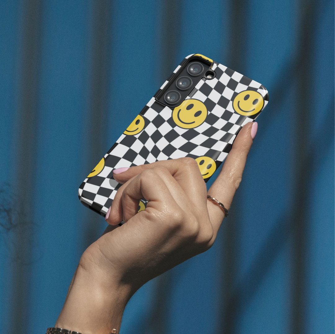 Samsung Galaxy case with black and white wavy checkerboard and yellow smiley face pattern – fun retro design for Galaxy S24 Ultra, S25, S24 FE.