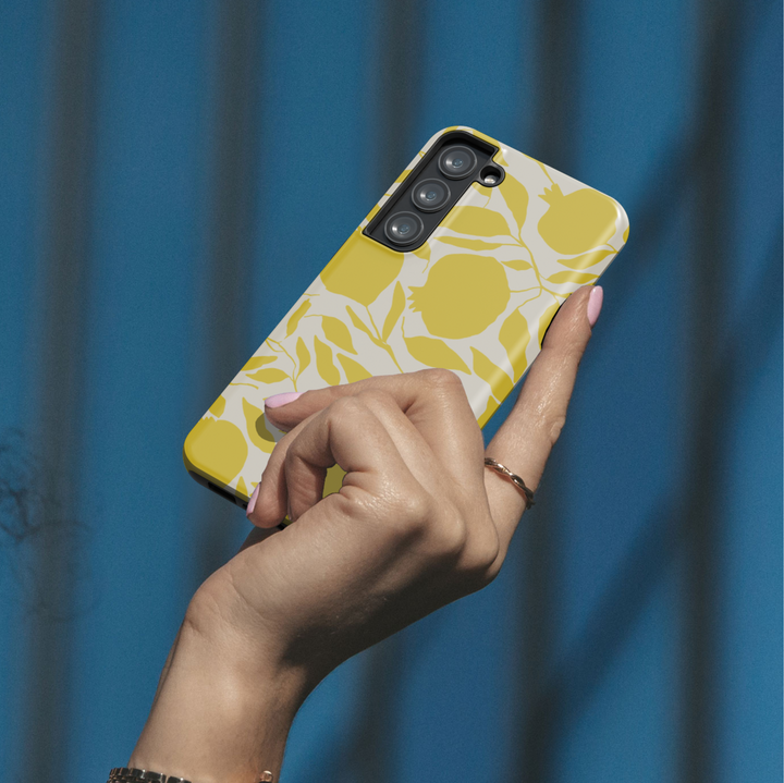 Samsung Galaxy phone case with modern yellow fruit and leaf silhouettes on a cream background – aesthetic citrus-themed design