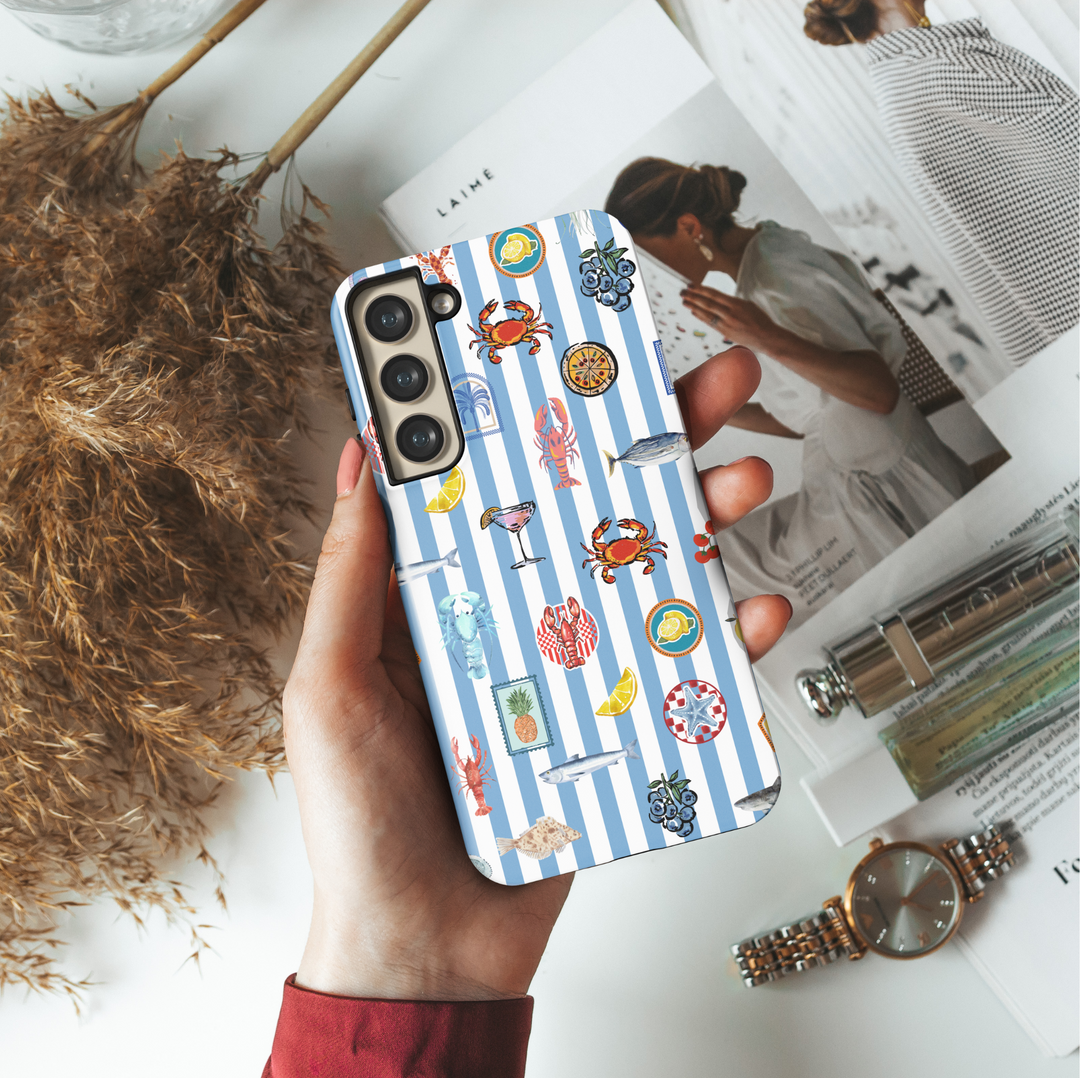 Samsung Galaxy phone case with blue and white stripes and colorful seafood, lemon, crab, and cocktail illustrations – coastal aesthetic tough case