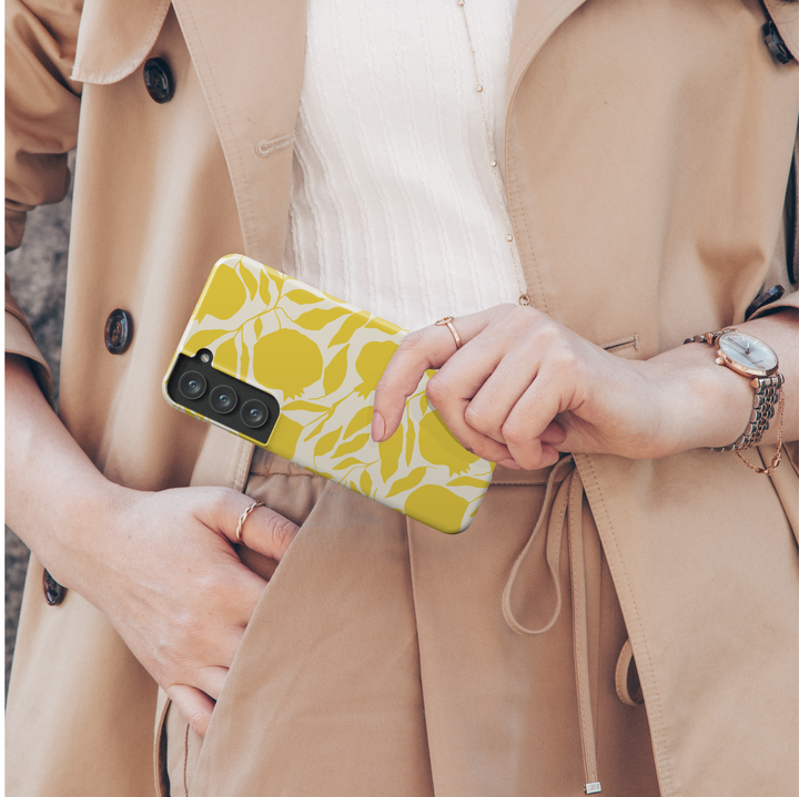 Samsung Galaxy phone case with modern yellow fruit and leaf silhouettes on a cream background – aesthetic citrus-themed design