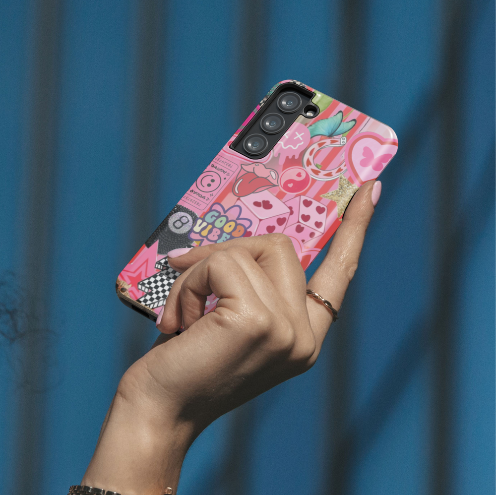 Samsung Galaxy phone case with pink sticker collage including good vibes text, heart playing cards, retro phone, cheetah, and butterfly. Compatible with Galaxy S24 Ultra, S24 Plus, and S23 FE. Bold, playful aesthetic.