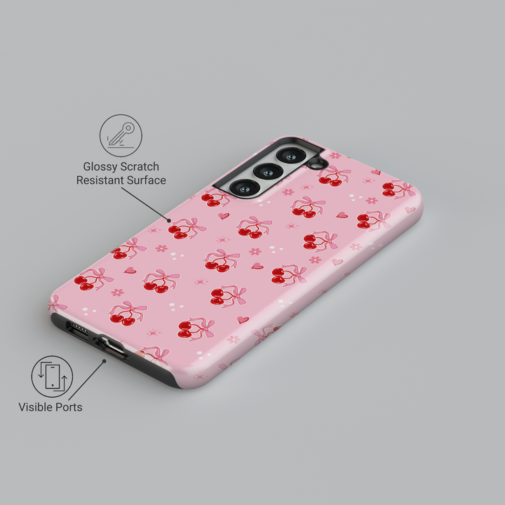 Coquette pink Samsung Galaxy case with red cherries, heart bows, and floral accents – cute girly aesthetic protective phone cover