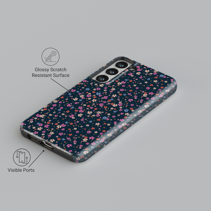Galaxy phone case with tiny multicolored floral print on dark navy background – aesthetic garden-style design