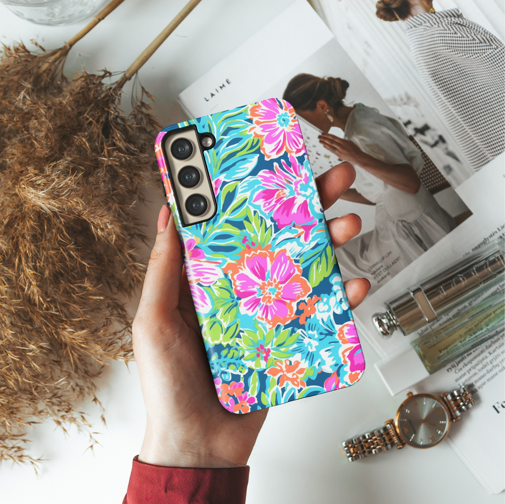 Samsung Galaxy case with bright tropical floral pattern in pink, orange, green, and blue – summer aesthetic tough cover