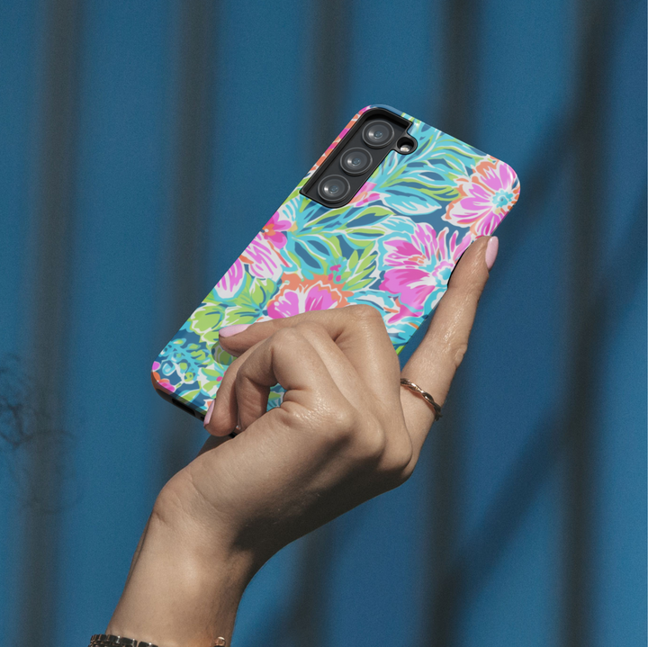 Samsung Galaxy case with bright tropical floral pattern in pink, orange, green, and blue – summer aesthetic tough cover