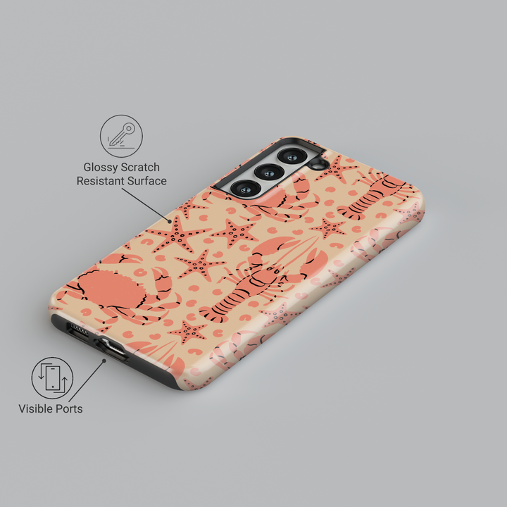 Samsung Galaxy case with coral lobster, crab, and starfish pattern on beige background – beach-themed design for Galaxy S24 Ultra, S25, and S24 FE.