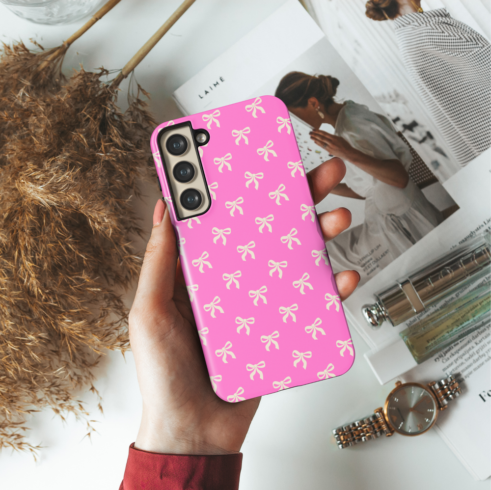 Samsung Galaxy case with cream bow pattern on hot pink background – girly coquette aesthetic phone cover