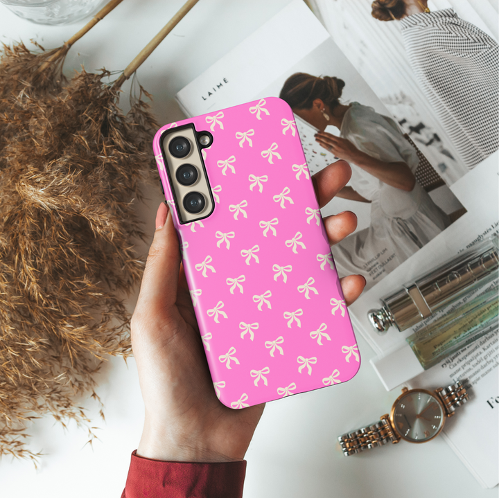 Samsung Galaxy case with cream bow pattern on hot pink background – girly coquette aesthetic phone cover