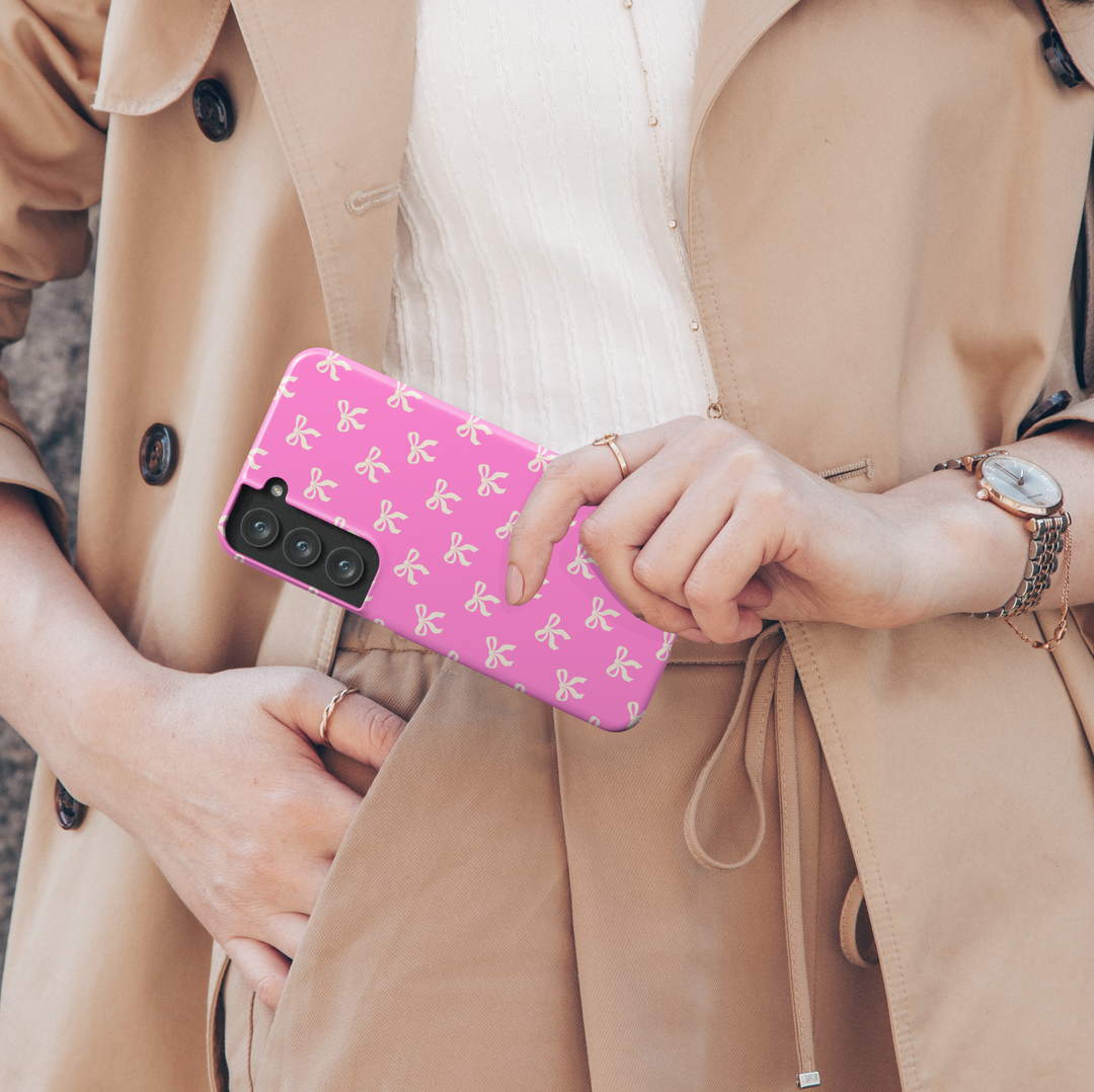 Samsung Galaxy case with cream bow pattern on hot pink background – girly coquette aesthetic phone cover
