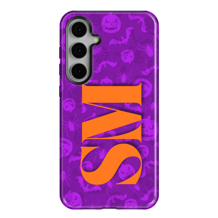 Samsung Galaxy S25 Ultra and S24 FE Halloween phone case with purple spooky background pattern of bats, pumpkins, and spiders, featuring bold orange monogram.