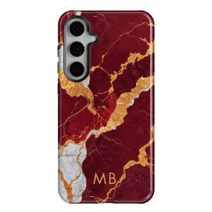 Samsung Galaxy S25 Ultra and S24FE tough phone case with deep red marble, gold veins, and custom monogram design.