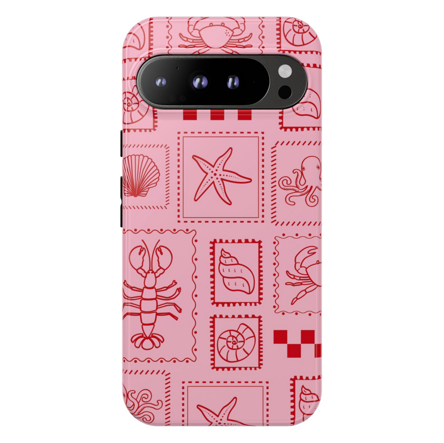 Pink Google Pixel case with red sea creature stamps including lobster, shell, starfish, crab, and octopus in a playful coastal grid pattern
