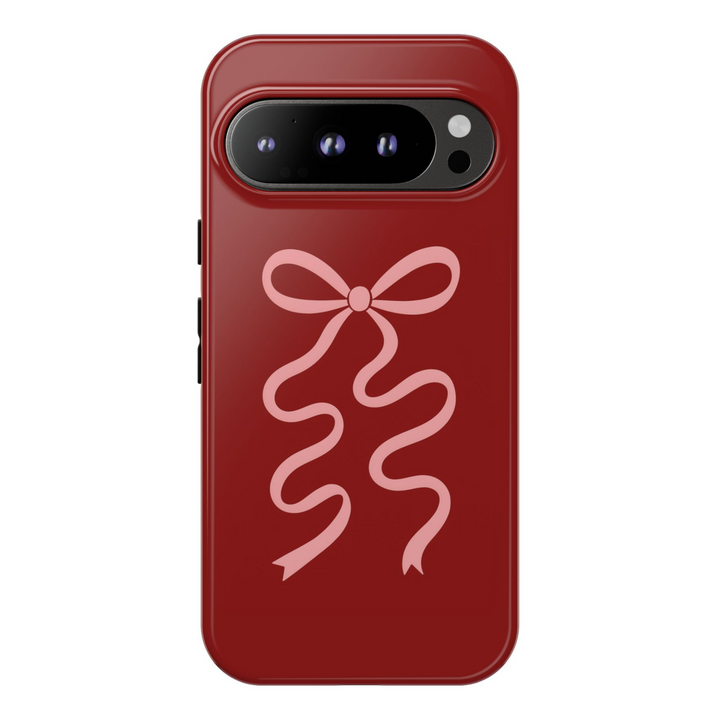 Dark red Google Pixel tough phone case with pink wavy ribbon bow – aesthetic coquette-inspired cover for Pixel 8, Pixel 8 Pro, and Pixel 9 Pro XL
