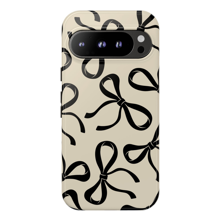 Glossy beige Google Pixel case with large black bow pattern – protective and stylish cover compatible with Pixel 8, Pixel 8 Pro, Pixel 9 Pro XL