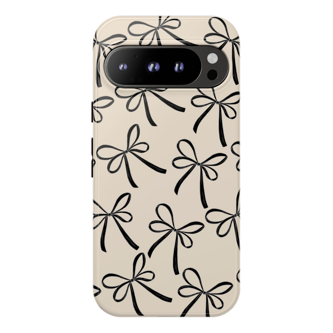 Minimalist beige Google Pixel tough phone case with black hand-drawn bow pattern, compatible with Pixel 8, Pixel 8 Pro, Pixel 9 Pro XL