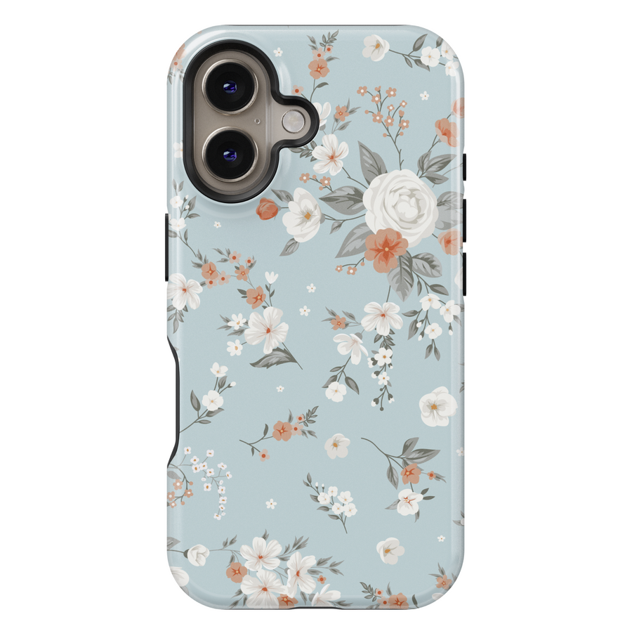 iPhone case with an elegant vintage floral design featuring ivory roses, orange blossoms, and soft greenery on a muted dusty blue background.