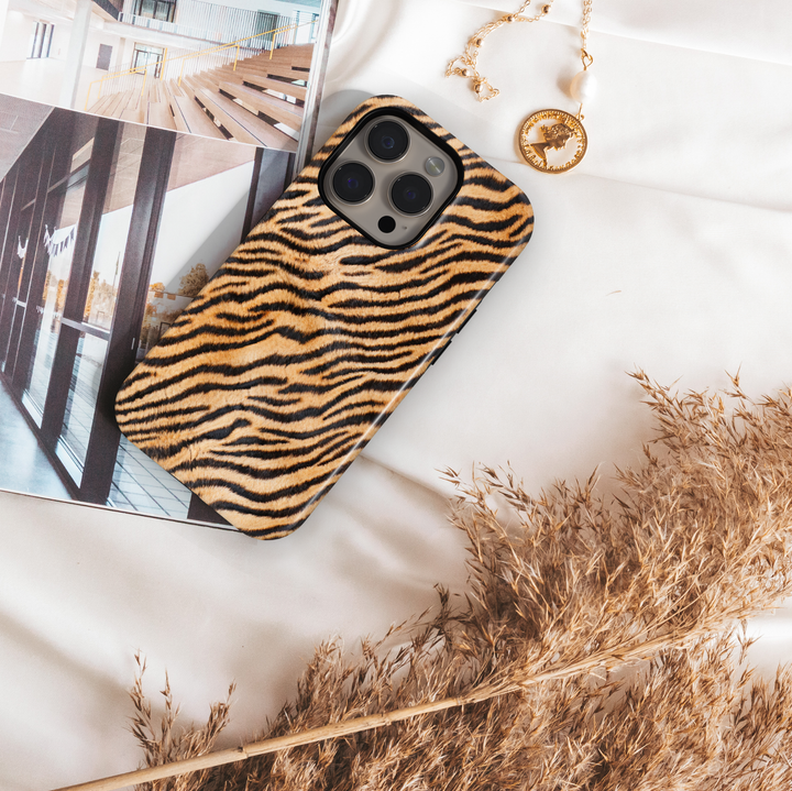 Tiger stripe phone case with orange and black fur pattern, realistic animal print protective cover for iPhone and Samsung
