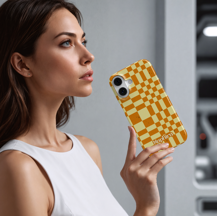 Orange and cream plaid iPhone case with oversized checkerboard pattern, warm autumn aesthetic phone cover, trendy retro grid iPhone 15, iPhone 14, iPhone 13 Pro Max case.