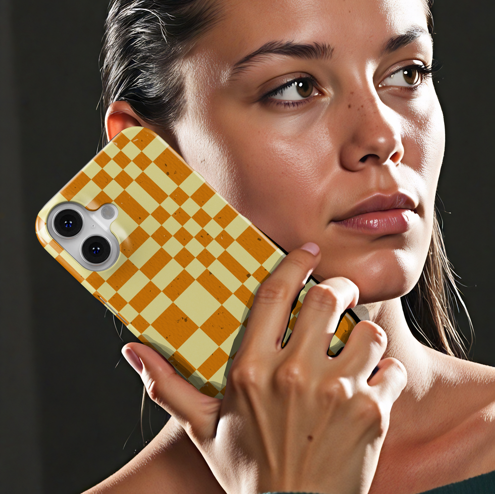 Orange and cream plaid iPhone case with oversized checkerboard pattern, warm autumn aesthetic phone cover, trendy retro grid iPhone 15, iPhone 14, iPhone 13 Pro Max case.