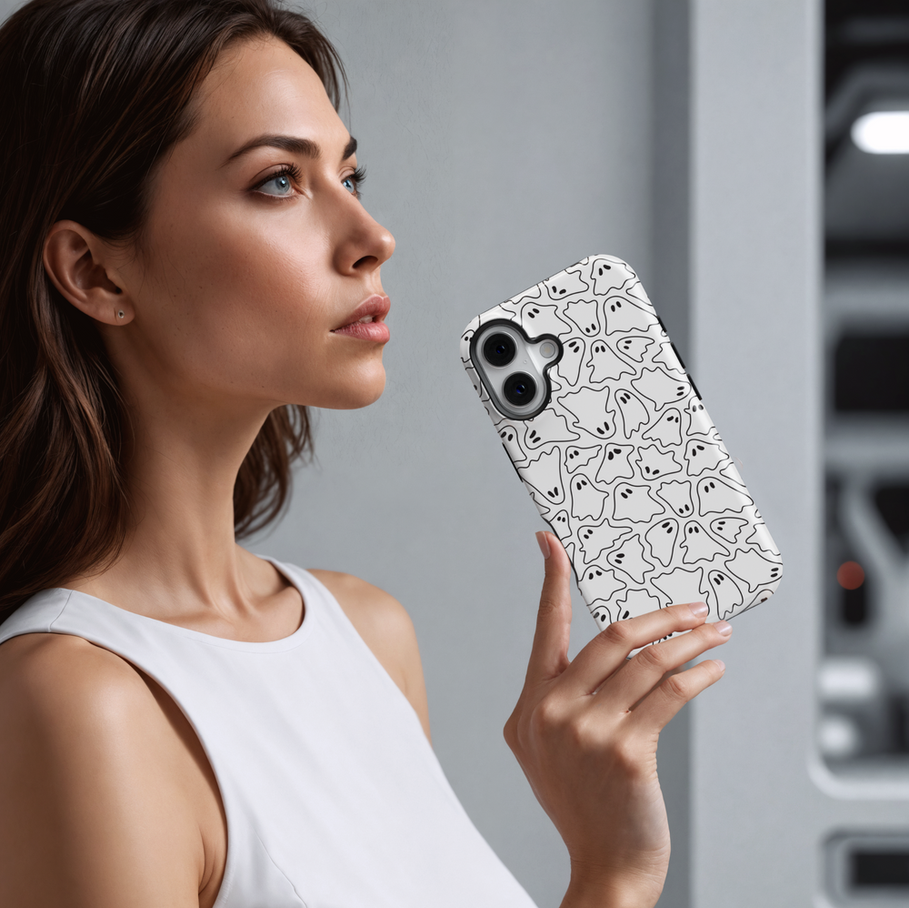White iPhone case with black outlined ghost pattern. Minimalist Halloween ghost aesthetic, spooky and cute doodle design. Fits iPhone 16, 15, 14, 13 models.