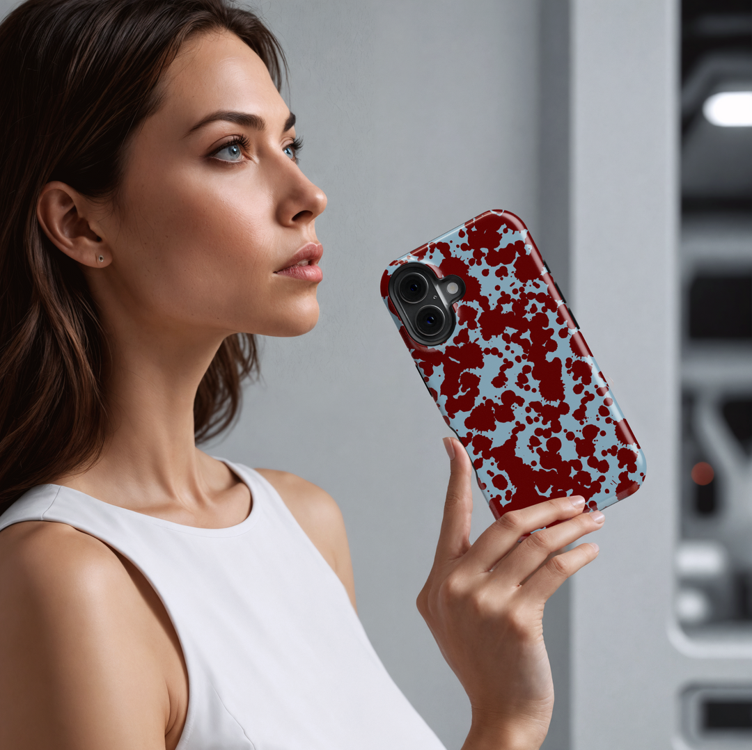 Abstract red paint splatter iPhone case on light blue background – Tough protective phone cover for iPhone 15, 14, 13, 12, 11 models