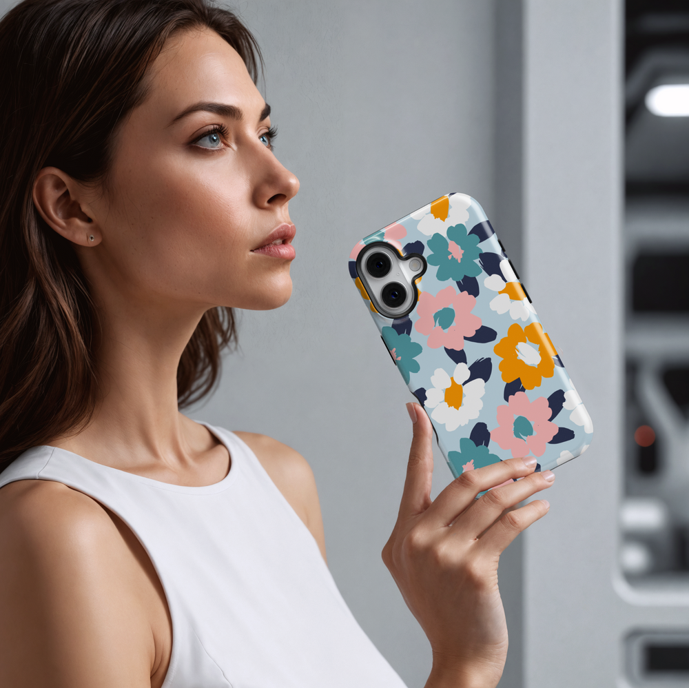 Cute iPhone case with abstract floral print in pastel pink, teal, white, and mustard yellow on a light blue background. Perfect for spring or summer aesthetics.