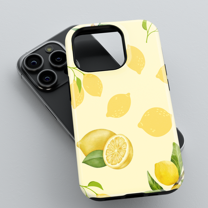 iPhone 16 case with lemon fruit design, yellow citrus pattern phone case for women, cute girly MagSafe iPhone case with soft pastel background
