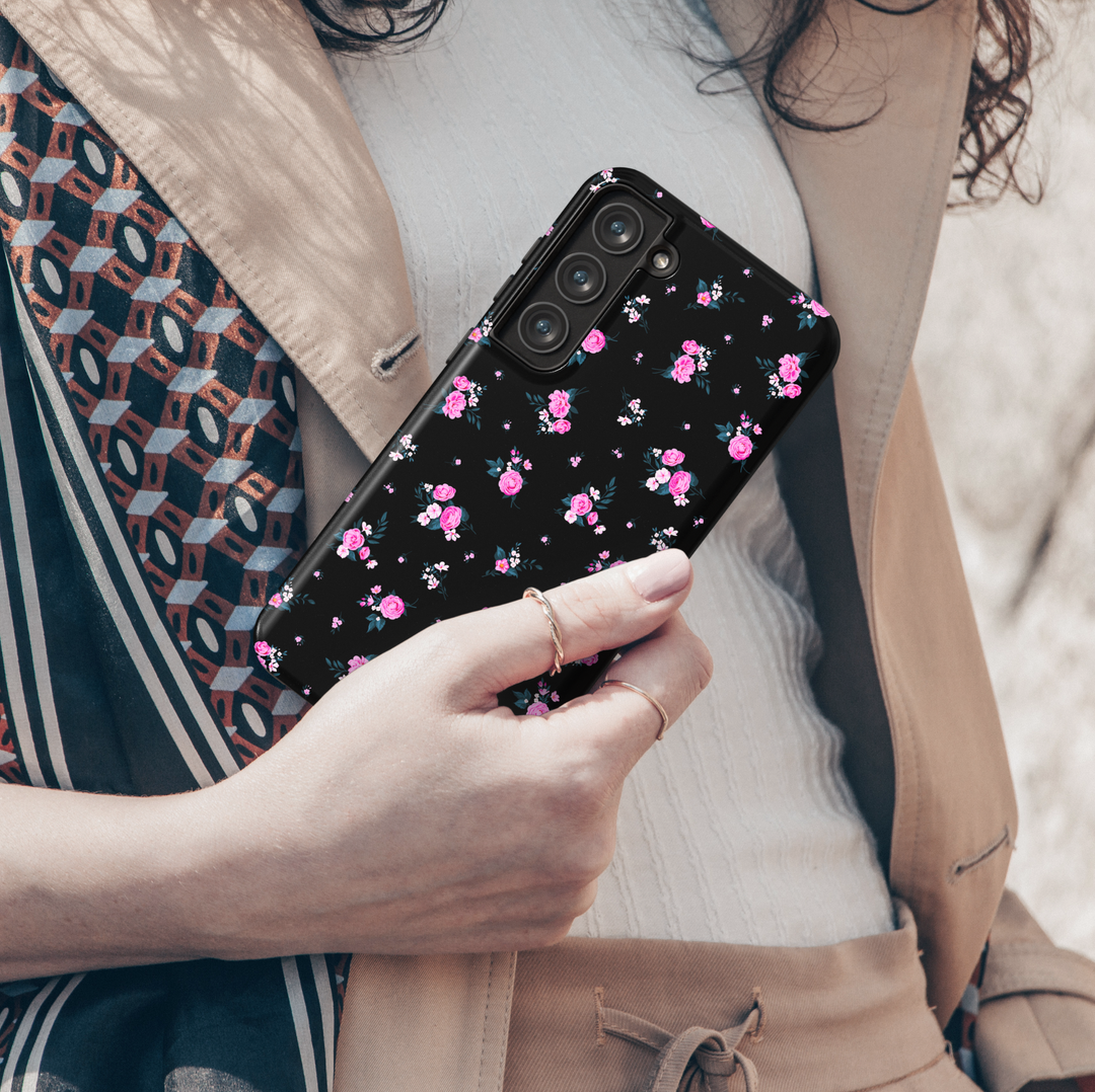 This black floral Galaxy case features tiny pink blossoms scattered across a glossy finish — feminine with a bold twist. Fits Galaxy S24 Ultra, S24 Plus, and S23 FE. Trendy, protective, and pretty.