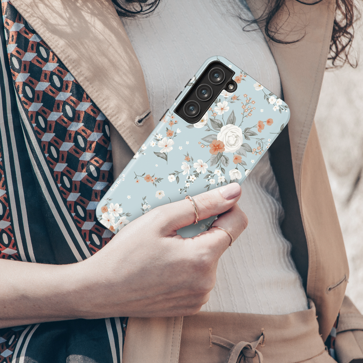 Light blue Samsung Galaxy case with white and peach floral print – soft romantic vintage-inspired aesthetic protective phone cover